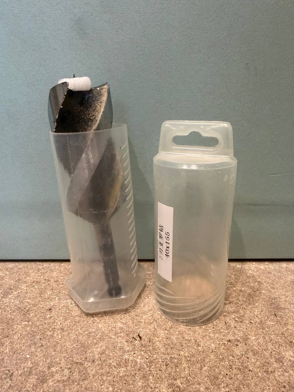 hsawbit 40x155mm wood auger bit shown in and out of its plastic storage case, label showing 40x155 dimensions